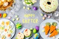 Funny colorful Easter food for kids with decorations on table. Easter dinner concept