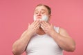 Happy plump man with shaving foam on his face and razor isolated on pink Royalty Free Stock Photo