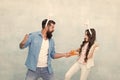 funny competition. father and daughter start carrot fight. have fun in hare costume. dad and child wear bunny ears Royalty Free Stock Photo