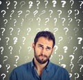 Funny confused skeptical man thinking looking up has many questions Royalty Free Stock Photo