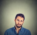 Funny confused skeptical man thinking looking up Royalty Free Stock Photo