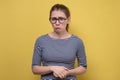 Funny confused woman in glasses being sad and disappointed