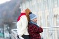 Funny couple back to back. smiling woman leans to guy back. Man holds woman back and closed eye. Royalty Free Stock Photo