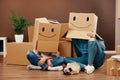 Funny Couple With Boxes On Heads Royalty Free Stock Photo