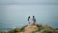 Funny couple dancing sea coast hill cloudy evening. Pair hugging on ocean shore. Royalty Free Stock Photo