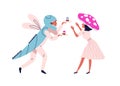 Funny couple in festive halloween mushroom and dragonfly costume. People in masquerade clothes with cupcakes in holiday