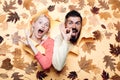 Funny couple are getting ready for autumn sale. Funny fac . Happy family in Autumn.