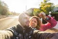 Funny couple With Keys Standing Outside New Home. Real estate, owner and people concept Royalty Free Stock Photo