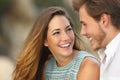 Funny couple laughing with a white perfect smile Royalty Free Stock Photo