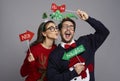 Funny couple in love with photo booth gadgets