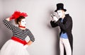 Funny couple of mimes taking a photo, April Fools Day