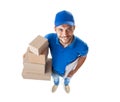 Funny courier with boxes looking at camera isolated on white background Royalty Free Stock Photo