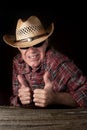 Funny cowboy making OK hand gesture