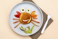 Funny crab face shape snack from pancake,apples,banana,kiwi on plate. Cute kids childrens baby`s sweet dessert, healthy breakfast Royalty Free Stock Photo