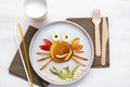 Funny crab face shape snack from pancake,apples,banana,kiwi on plate. Cute kids childrens baby`s sweet dessert with milk, healthy Royalty Free Stock Photo