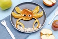 Funny crab face shape snack from pancake, orange,apples,honey on plate. Cute kids childrens baby`s sweet dessert, healthy Royalty Free Stock Photo