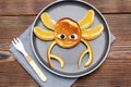 Funny crab face shape snack from pancake, orange on plate. Cute kids childrens baby`s sweet dessert, healthy breakfast,lunch, foo Royalty Free Stock Photo