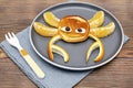 crab face shape snack from pancake, orange on plate. Cute kids childrens baby\'s sweet dessert, healthy breakfast,lunch, foo Royalty Free Stock Photo