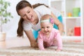 Funny crawling baby girl with mother Royalty Free Stock Photo