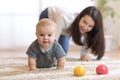 Funny crawling baby with mother