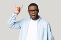 Funny crazy african american young man showing horns gesture. Royalty Free Stock Photo