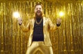 Funny crazy bearded chubby man in shiny golden suit having fun at disco club party