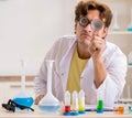 Funny crazy chemist doing experiments and tests Royalty Free Stock Photo