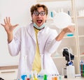 Funny crazy chemist doing experiments and tests Royalty Free Stock Photo