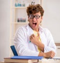 Funny crazy chemist doing experiments and tests Royalty Free Stock Photo