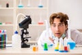 The funny crazy chemist doing experiments and tests Royalty Free Stock Photo