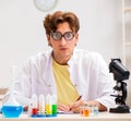 Funny crazy chemist doing experiments and tests Royalty Free Stock Photo