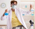 Funny crazy chemist doing experiments and tests Royalty Free Stock Photo