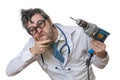 Funny and crazy doctor is laughing and holds saw in hand on whit