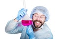 Funny crazy emotional chemist with flask. mad scientist in his laboratory experimenting on secret formulas. Royalty Free Stock Photo