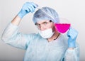 Funny crazy emotional chemist with flask. mad scientist in his laboratory experimenting on secret formulas. Royalty Free Stock Photo