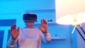 Funny crazy granny. Elderly woman wearing VR goggles