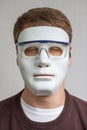 Funny and crazy guy with plain white mask Royalty Free Stock Photo