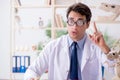 The funny crazy professor studying animal skeletons Royalty Free Stock Photo