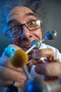 Crazy scientist with structure of model molecules Royalty Free Stock Photo