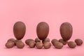 Funny creative concept of flying Easter eggs on pink background