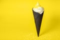 Funny creative concept of vanilla soft serve ice cream in black