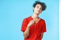 funny curly guy in a red t-shirt pizza delivery fast food snack Royalty Free Stock Photo