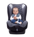 Funny cute baby sitting in a car seat, isolated Royalty Free Stock Photo