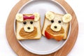 Funny cute bear,dog face sandwich toast bread with peanut butter, banana and apple. Kids childrens baby`s sweet dessert healthy Royalty Free Stock Photo