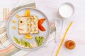 Funny cute fish shape sandwich toast bread with banana, apple,orange, milk,honey. Kids childrens baby`s sweet dessert healthy