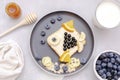 Funny cute fish shape sandwich toast bread with blueberry,great bilberry,orange,milk,honey.Kids childrens baby's