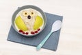 Funny cute kids childrens babys breakfast lunch oatmeal porridge in bowl look like owl decoration with apple, banana, dried berry