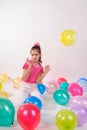 Funny cute little girl with baloons Royalty Free Stock Photo