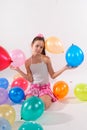 Funny cute little girl with baloons Royalty Free Stock Photo