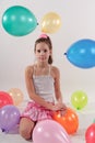 Funny cute little girl with baloons Royalty Free Stock Photo